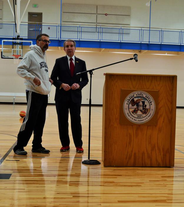 Roger Moellendorf confers with Mayor Bob Crowell before addressing the crowd of supporters