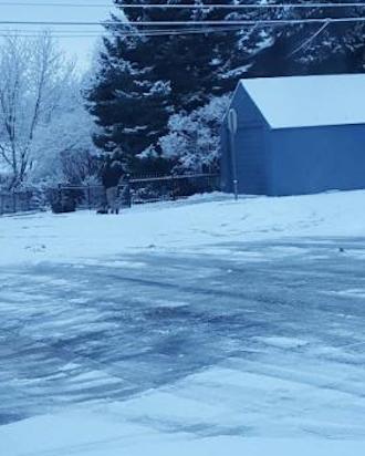 Principal at Pioneer High School shoveling the neighbors driveway. Reader submitted photo.