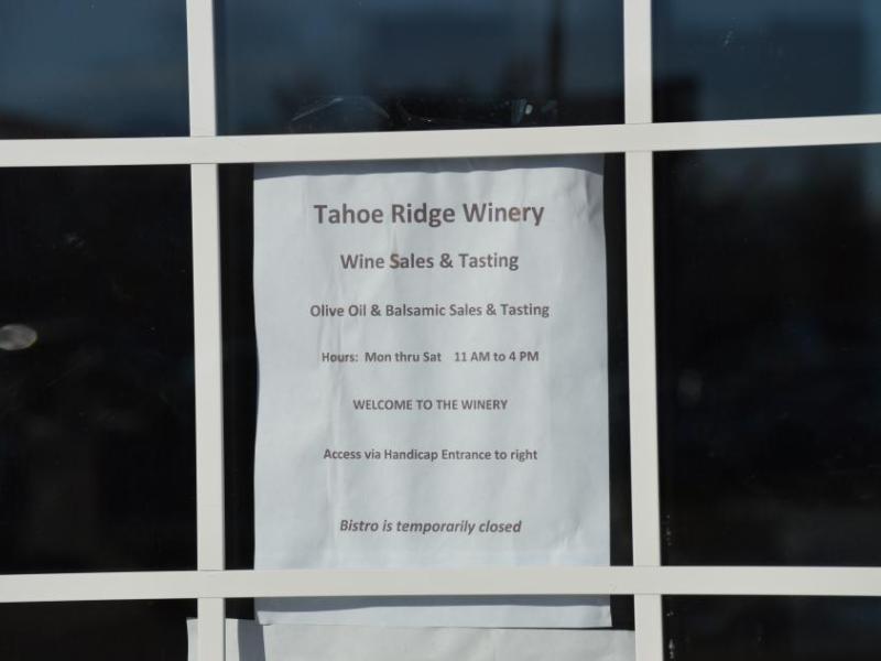 Notice on the front entrance of Tahoe Ridge Winery alerting customers that the bistro is temporarily closed.