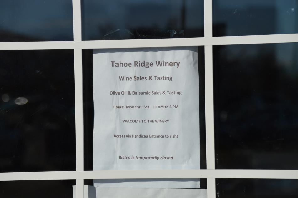 Notice on the front entrance of Tahoe Ridge Winery alerting customers that the bistro is temporarily closed.