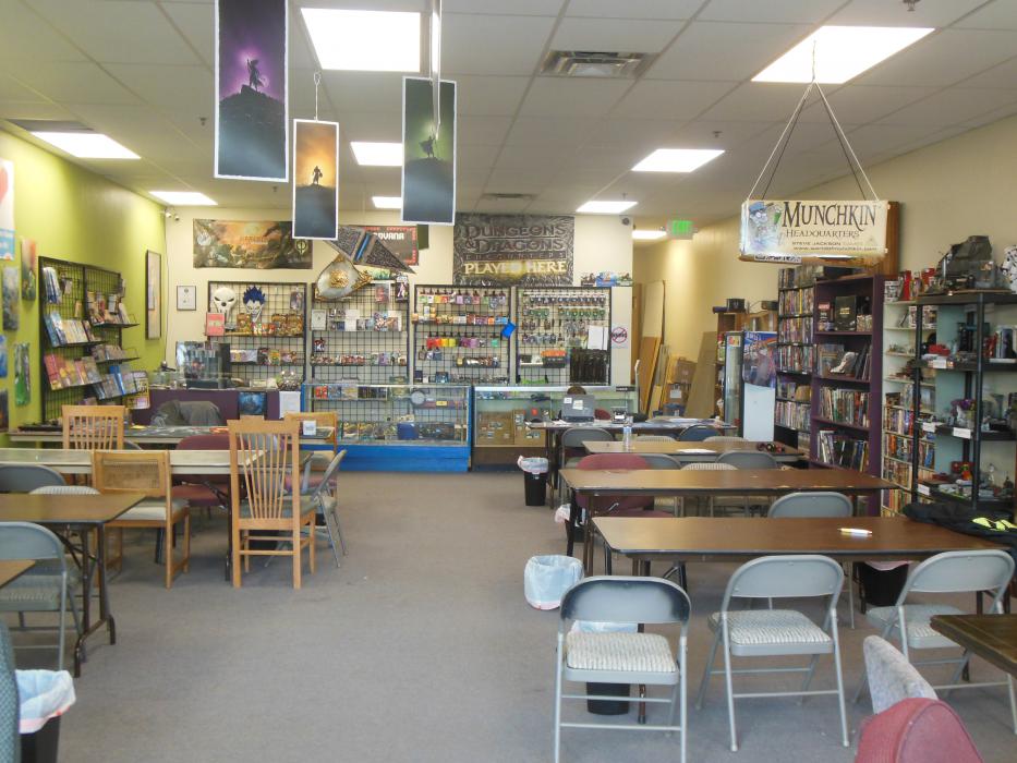 Interior of Nerdvana store, showing the game tables at the front of the business.