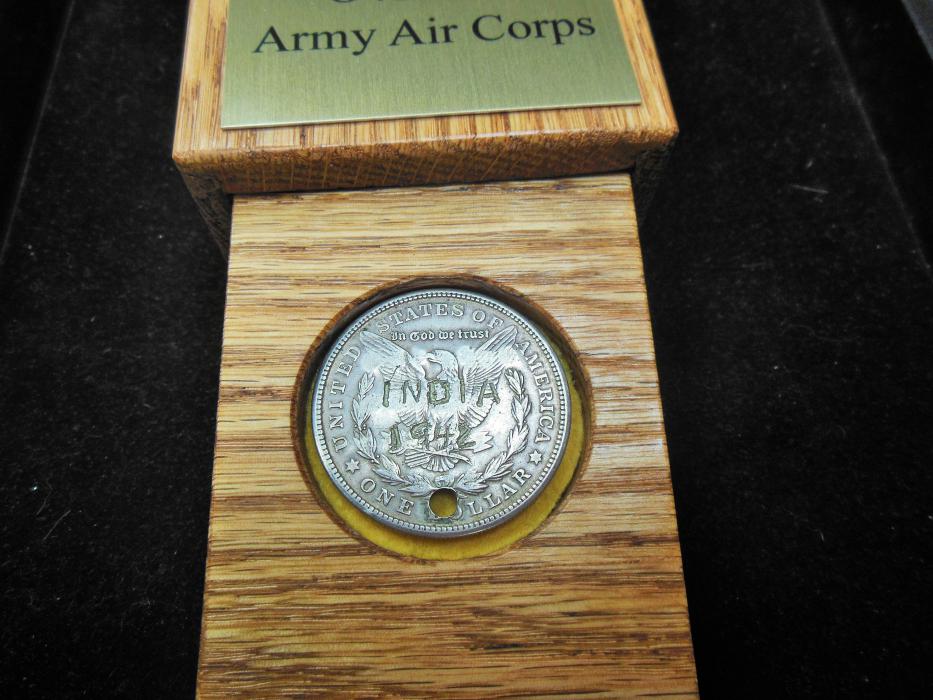 The back side of Lt. Col. Buxton's 1921 Morgan Silver Dollar with 