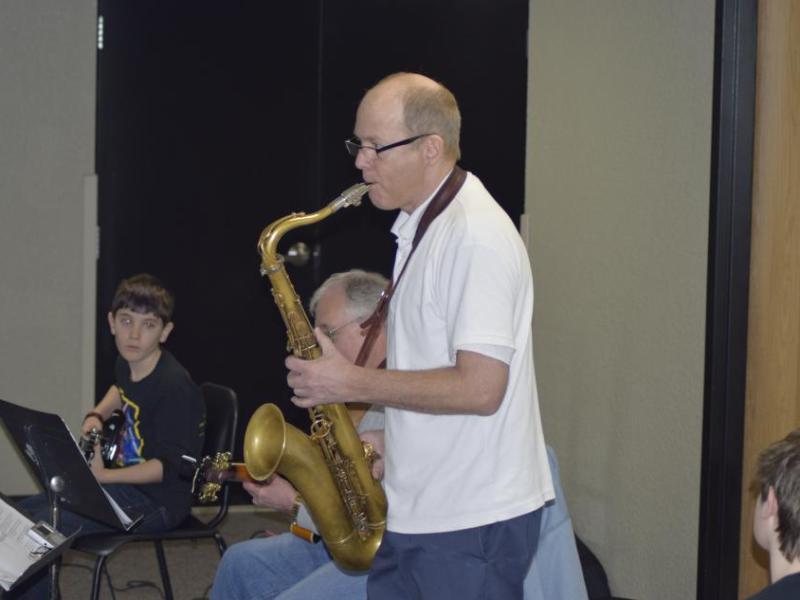 Mr. Kline plays a blues riff for students