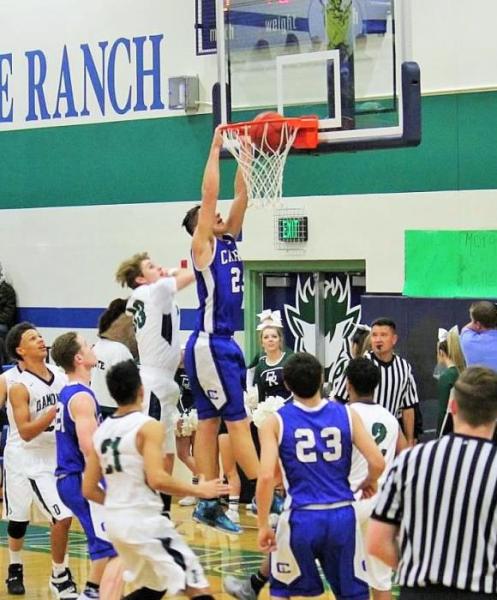 Jayden DeJoseph (25) dunks against Damonte Ranch Friday night. Photo courtesy Jenn Minifie.