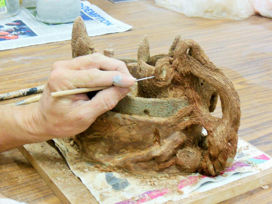 Rich McGregor sculpts from recycled clay.