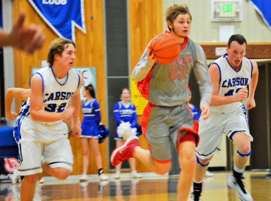 Kyle Krebs (32) and Ian Schulz (42) chase down a Wooster player Tuesday night at Carson High School.