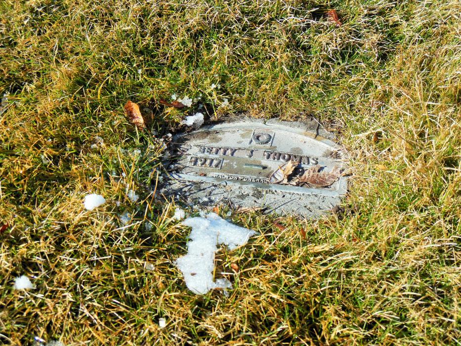 A temporary tin marker at a grave in Lone Mountain Cemetery.