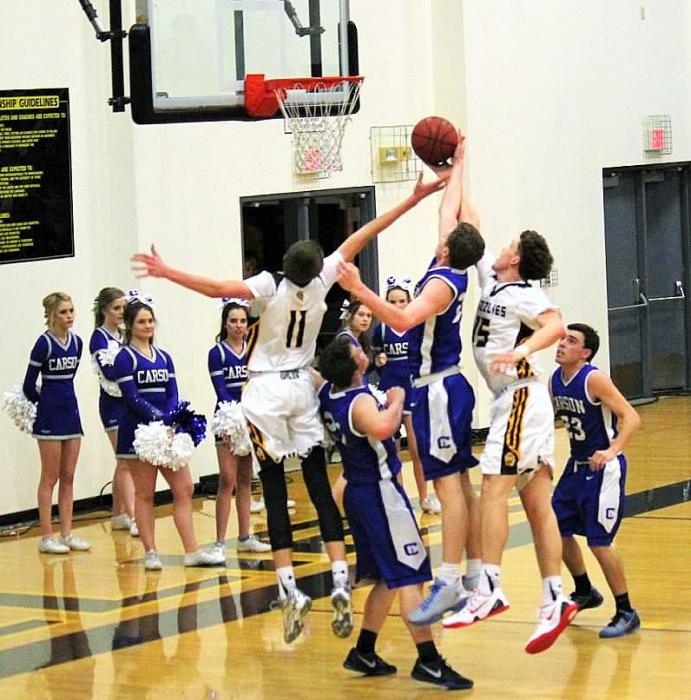 Photo courtesy Jenn Minifie, CHS. Tez Allen fights for a defensive rebound against Galena Friday night in Reno.