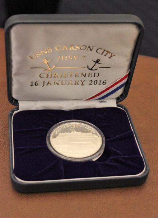 Commemorative coin depicting the USNS CARSON CITY. The other side shows the USS CARSON CITY.