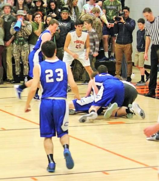 Photo courtesy Jenn Minifie, CHS. A pair of Senators dive after a loose ball Friday night at Douglas High School in Minden.