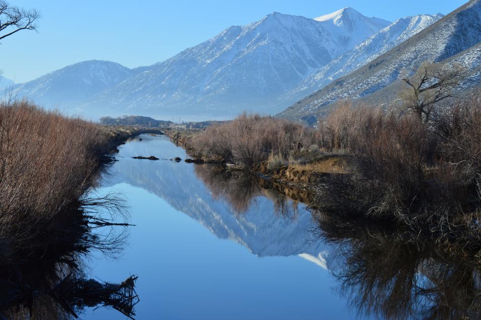 Morning stillness of the west fork of the Carson River in Genoa gives reflection to Job's Peak in the background.