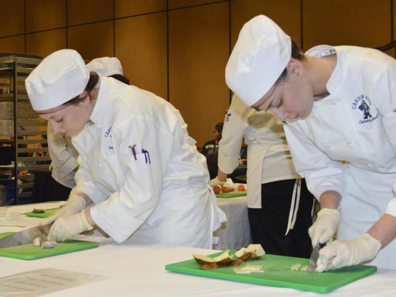 Culinary arts student practice with the knives.