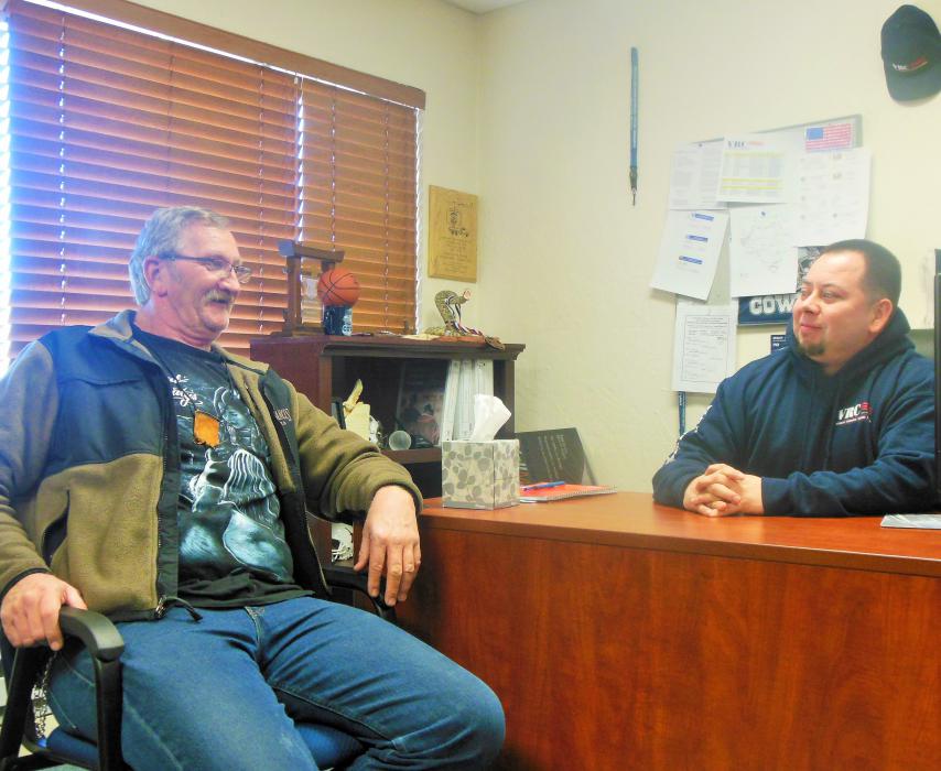 Thomas Kraft (left) speaks with Case Manager Frank Zuniga of the Veterans Resource Center on N. Carson St.