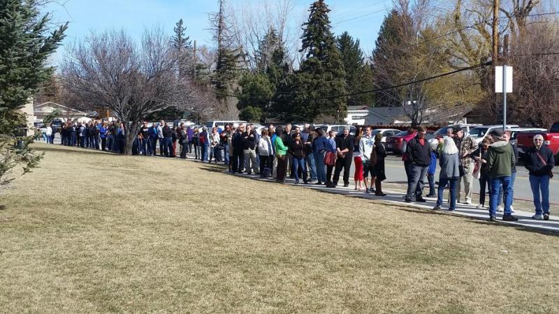 Democrats make line down the street to caucus at Carson Middle School