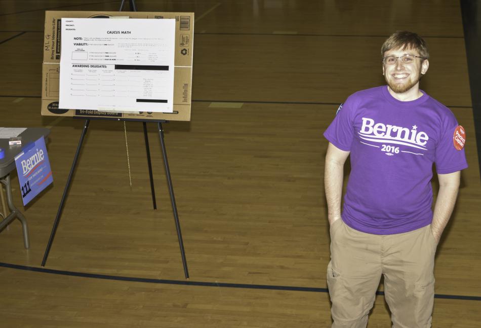 Volunteer engages caucusers