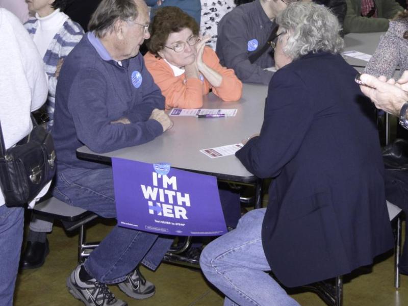 Voters caucusing for Hillary Clinton discuss the issues