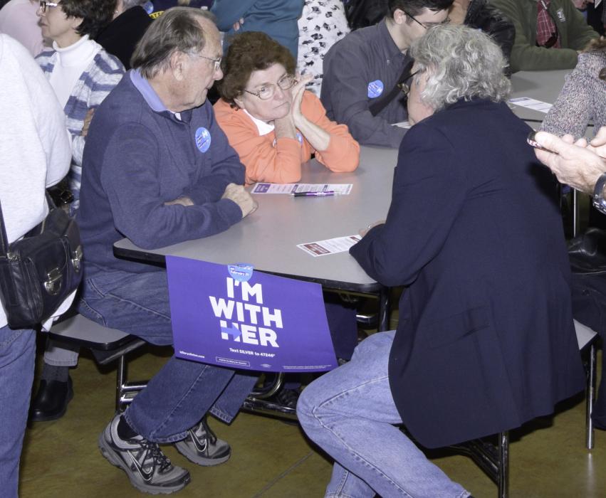 Voters caucusing for Hillary Clinton discuss the issues