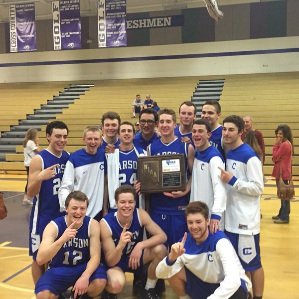 Photo courtesy Carson Hoops. CHS boys varsity basketball team poses with its regional trophy.