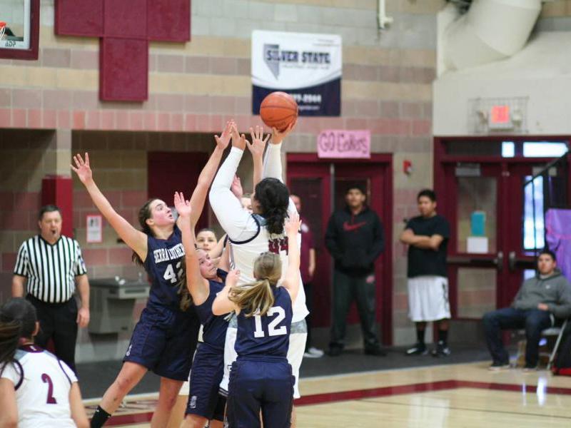 Sierra Junior Grace Bonafede (42), Junior Claire Cochran (12), and and Junior Clare Davison reach for the ball