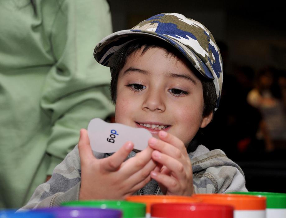 Four-year-old Kyle McEwan plays a game at the Carson City Library booth.