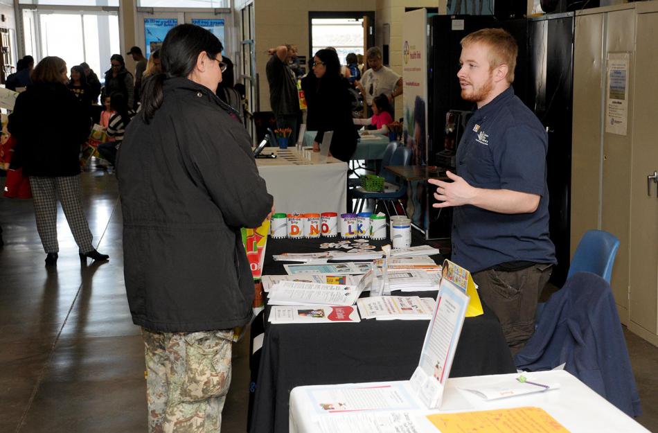 Aubrey White of the Carson City Library talks with a visitor at the Second Annual Early Childhood Expo.