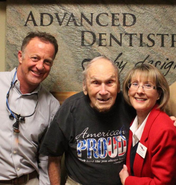 Photo courtesy AAVDP. Frank Minervini (center) with his dentist, Dr. Randy Wright, and AAVDP Founder Linda Haigh.