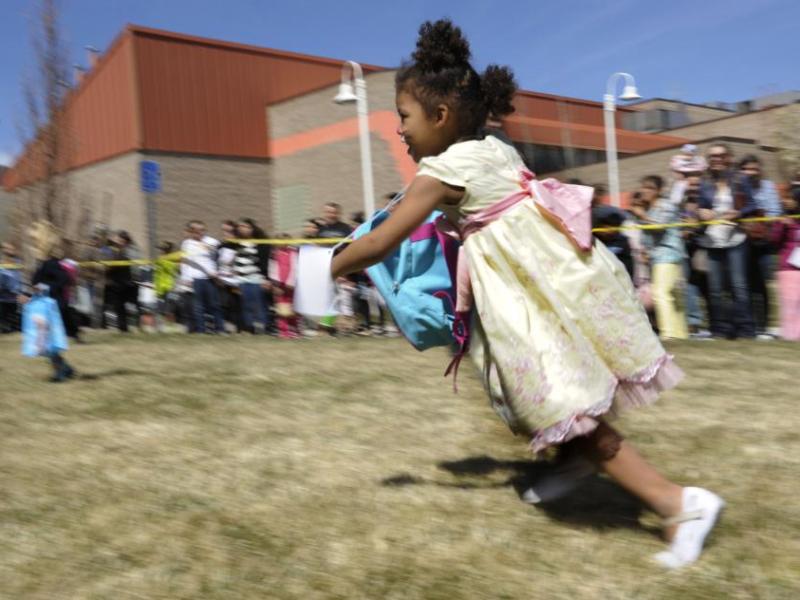 Amethyst Olivas, 4, of Carson City races for eggs during the 7th Annual Easter Fiesta held Saturday at Western Nevada College.