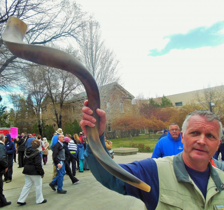 A Decision America volunteer shows an authentic Shofar horn, a Jewish religious instrument used since ancient times.