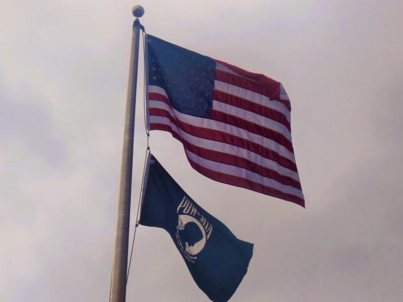American flag and POW-MIA flag flying at the Nevada Vietnam Memorial at Mills Park.