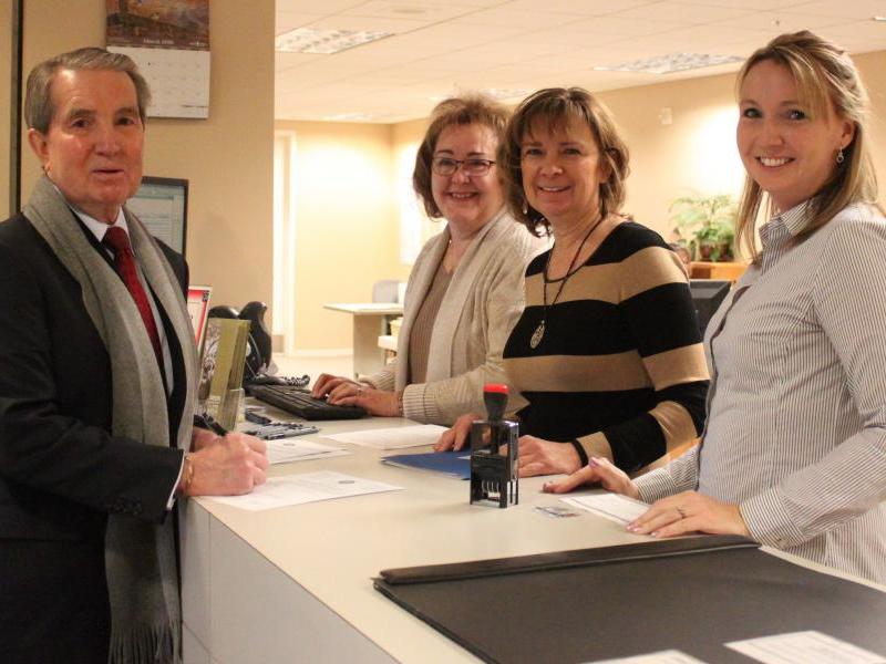 Carson City mayor Bob Crowell files his re-election paperwork with the staff at the Carson City County Clerk’s Office.