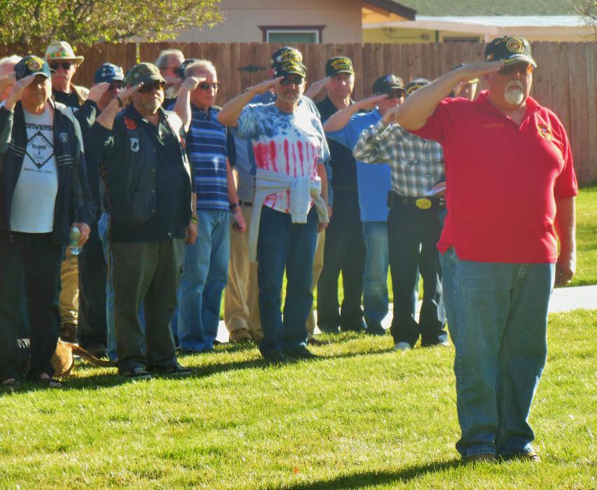 Frank Reynolds (right) and the VVA Chapter 388 salute during the playing of 