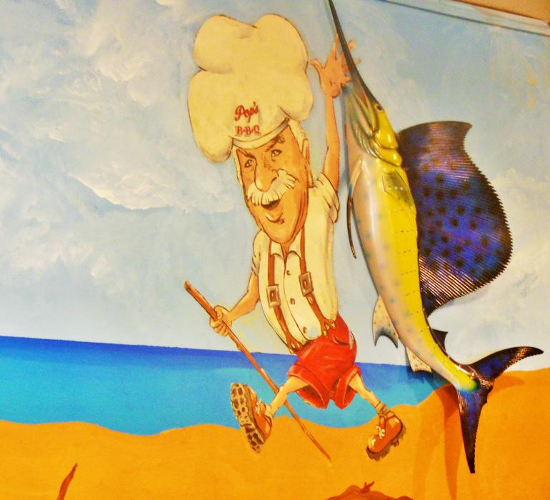 Mural and caricature of the original Pop, Doug's dad, Sidney Cramer.