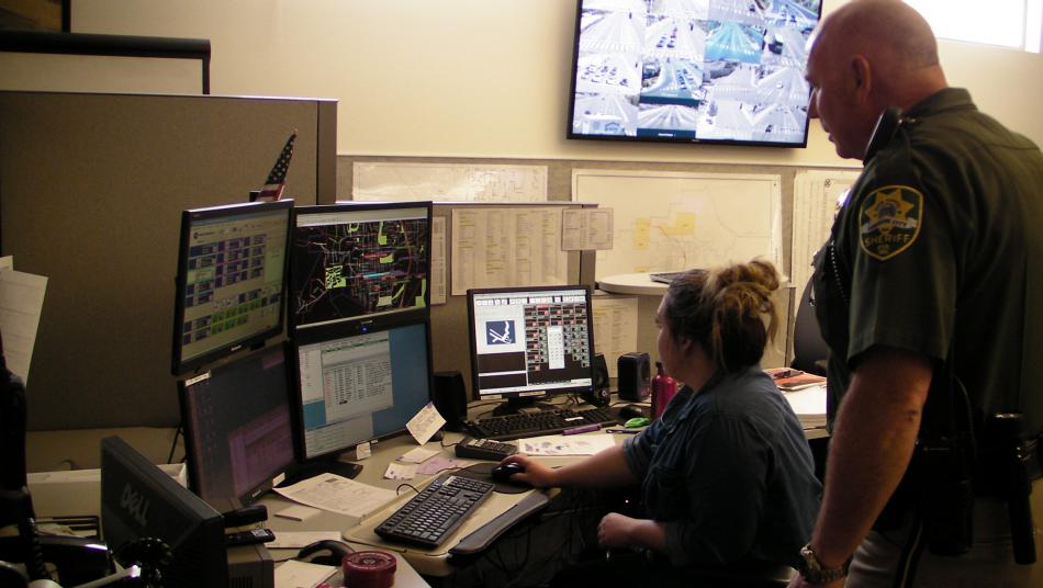 Carson City Sheriff's Office Dispatcher Danielle Dyer navigates as Capt. Jeff Melvin watches.