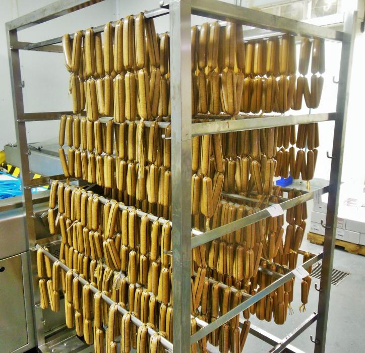 Links rest on a dry rack before being cured in the smokehouse.