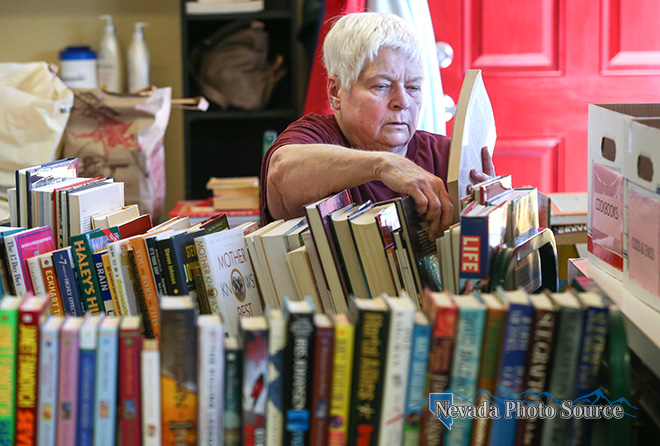 Volunteer Pat Blake sorts donated books at the Browsers Corner Bookstore. Cathleen Allison, Nevada Photo Source