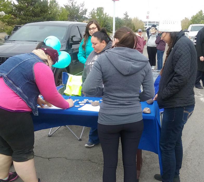Participants sign up for Saturday morning's walk.