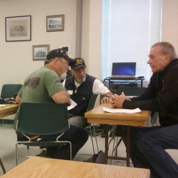 Vietnam veterans chat in the CCSO Ormsby Room Wednesday before the CCVCC meeting.