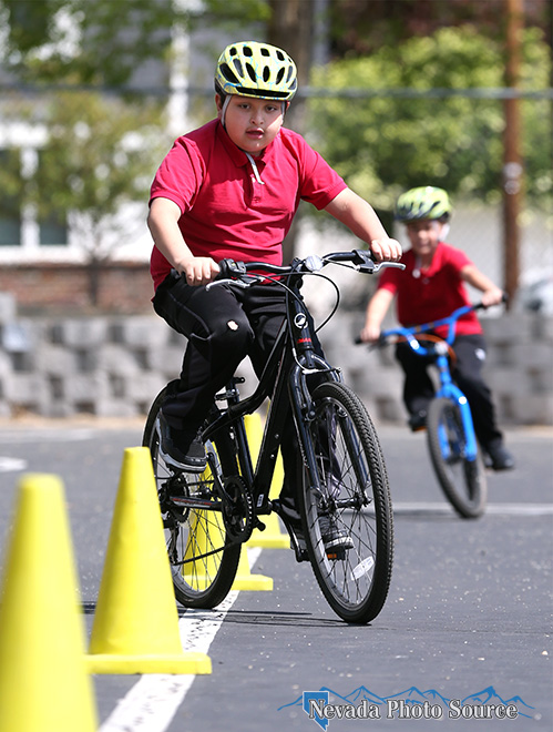 Axel Gutierrez Galan rides the obstacle course during a Bike Safety class at Bordewich-Bray Elementary School in Carson City.