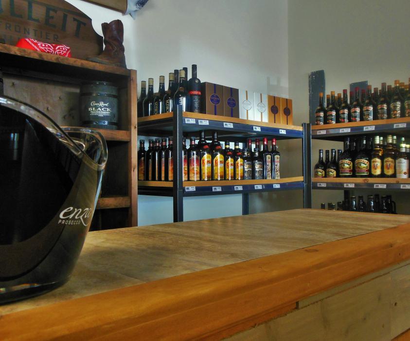 Wine tasting station at the back of the store.