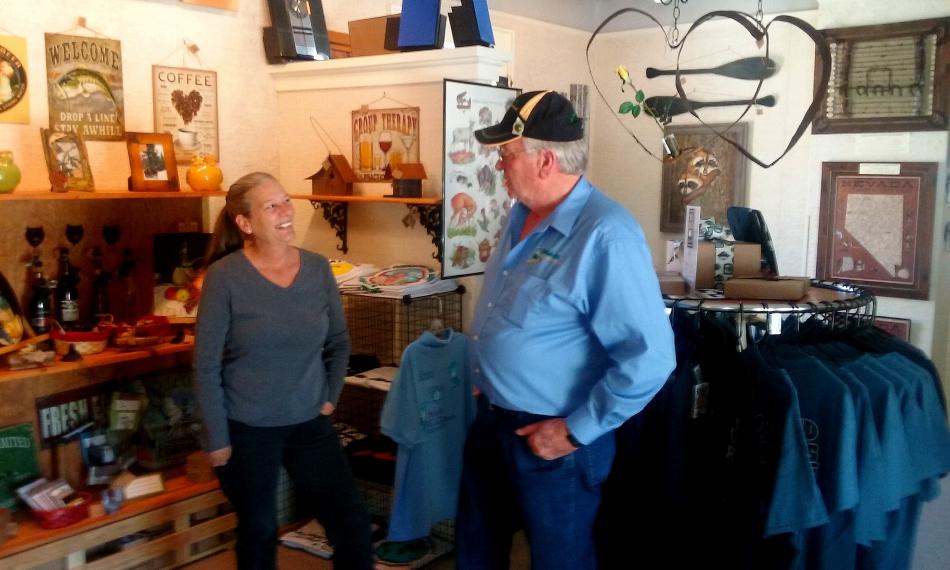 Owner Toni Thompson chats with visitor Ron Bell on the retail floor of Eagle Mountain Trading Post.