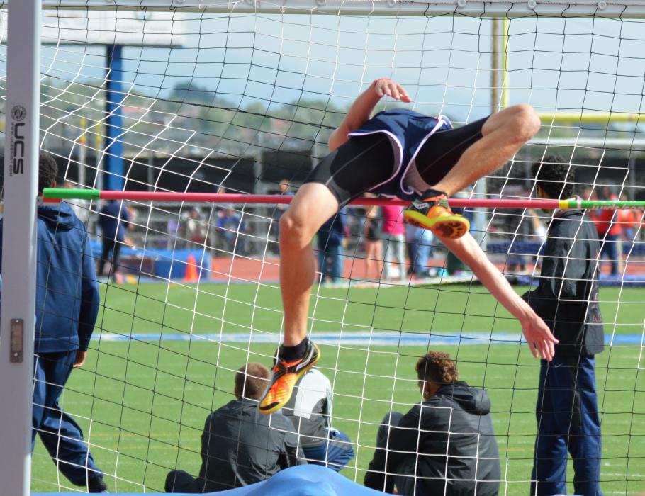 A high jumper clears the bar in the boys high jump competition Friday at the CHS track.