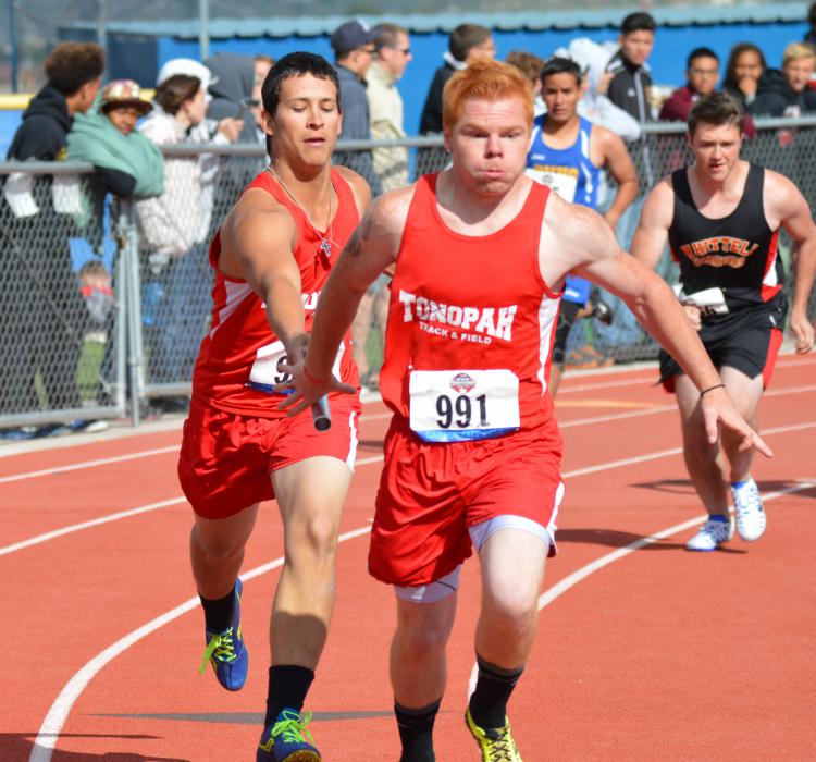 Tonopah sprinters complete the baton hand-off during the boys Division IV 4x200 relay Friday at the CHS track.
