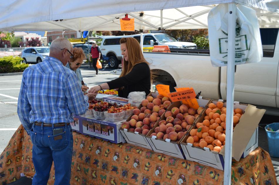 Photo by Lisa Fisher. Produce vendor at Saturday's Early Spring Farmer's Market.