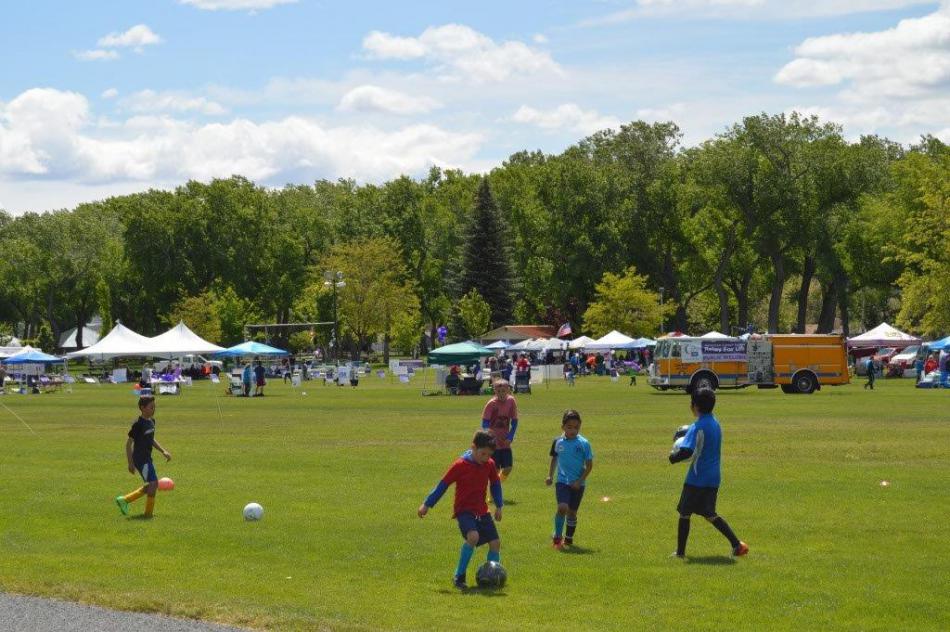 Kids play soccer while participants walk during Relay for Life at Mills Park on Saturday. Photo by Lisa Fisher