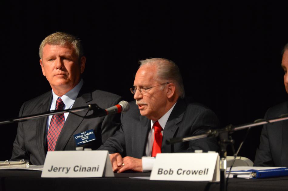 Chris Carver (left) listens while Jerry Cinani answers a question.
