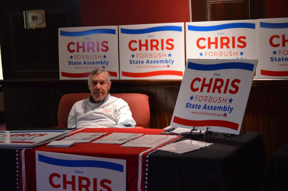 Supporter at the table of Assembly candidate Chris Forbush in the Performance Hall lobby.