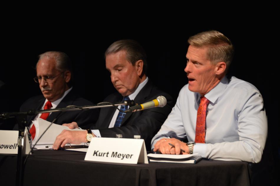 Kurt Meyer (right) answers a question while Jerry Cinani and Bob Crowell listen.