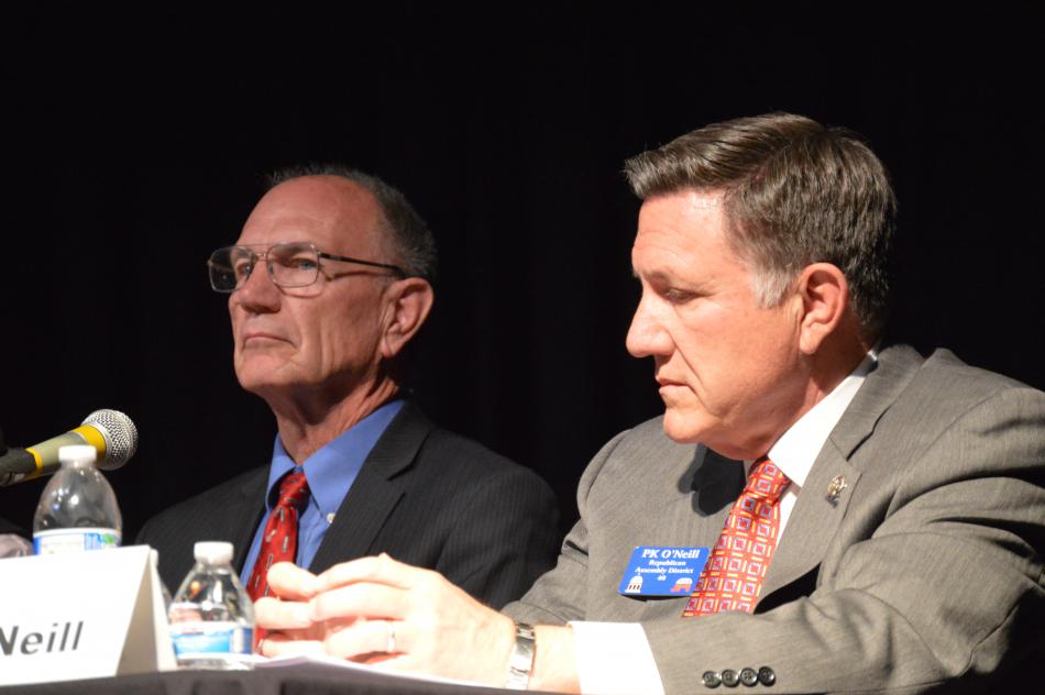Al Kramer (left) and PK O'Neill listen to a question from the moderator.