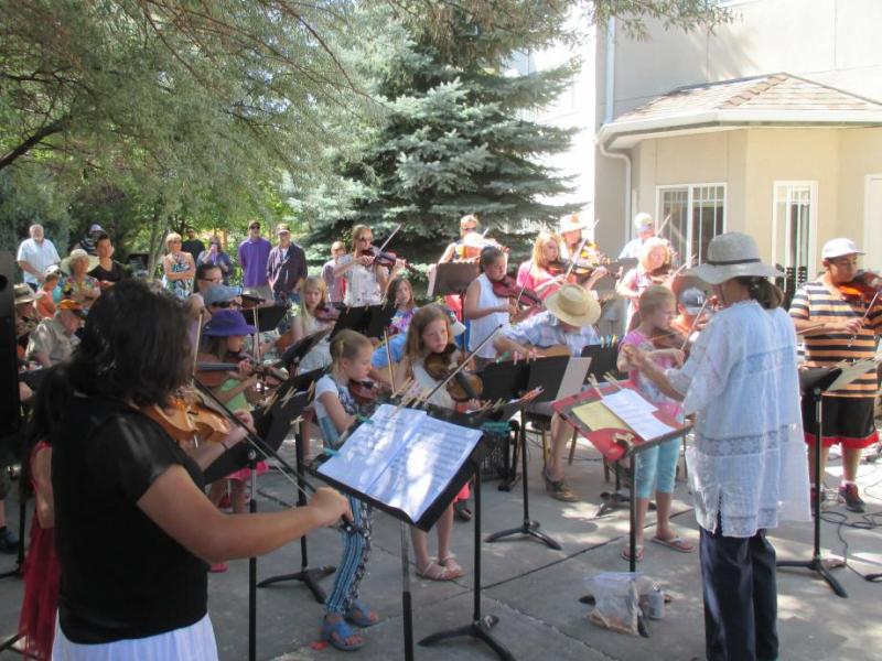 Sue Jesch leads Strings in the Summer participants of all ages in performance last July at Sierra Place.
