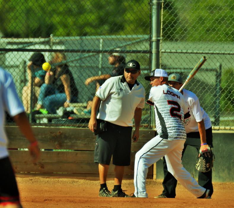 A batter readies his swing as the ball approaches home plate Saturday morning at Centennial Park.